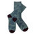 Pair of teal NZ souvenir socks with silver fern and koru motifs and dark heels and toes