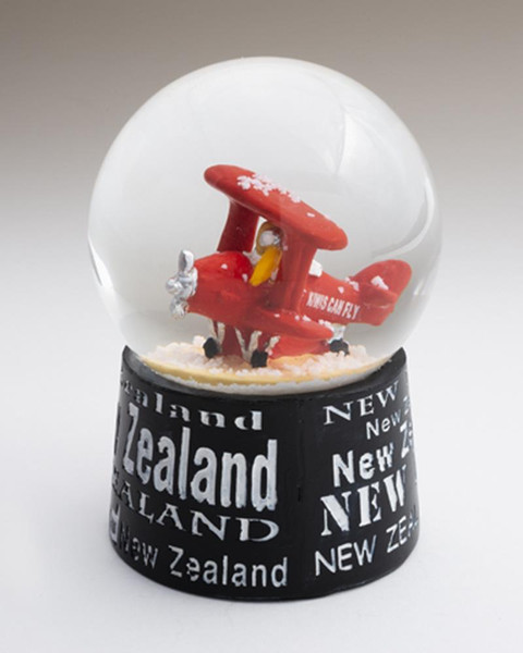 Kiwi in a bi-plane in a water ball with a little bit of glitter