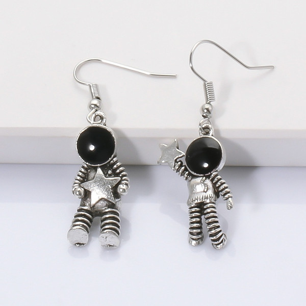 Astronaut earrings on hook