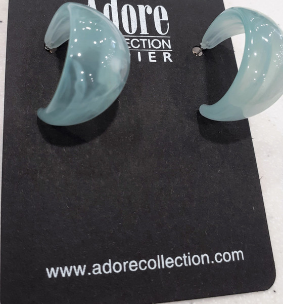light seafoam coloured resin half hoop earrings slightly wider in the middle tapering off each end