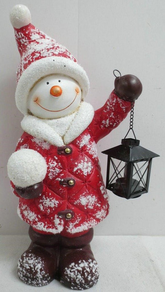 Snowman standing holding a lantern suitable for T lights