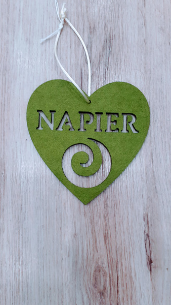 Napier and Koru cut out of hanging green felt heart