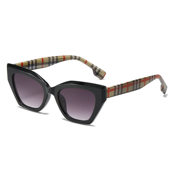 Black frame "cats eye" style sunglasses with colourful plaid arms and purple tint lens