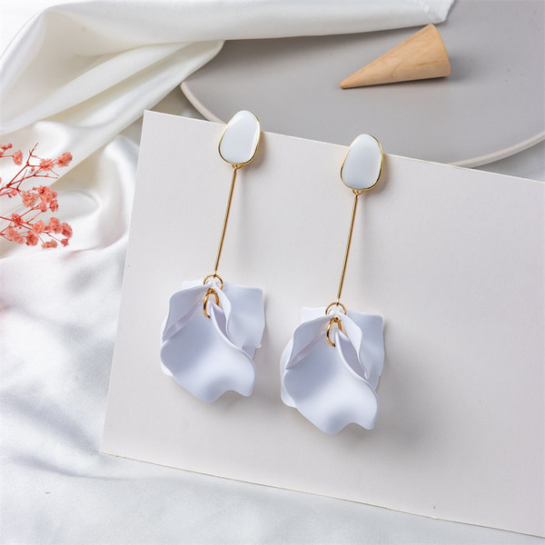 long earrings with white petals hung from gold coloured rod beneath an acrylic stud on s925 posts