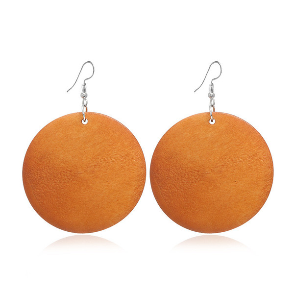 round mustard orange wooden earring on hooks