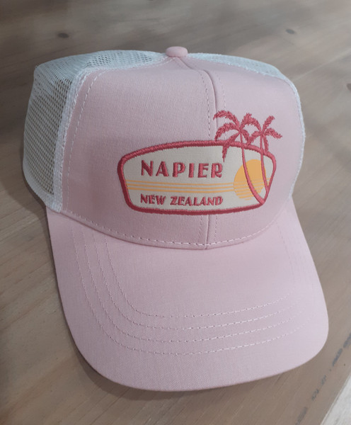 Napier, New Zealand pink cap with sun and palm trees