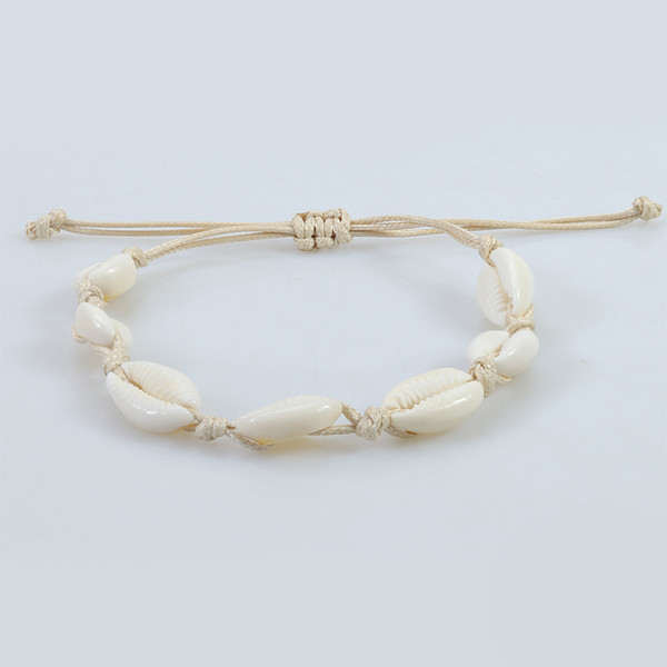 Shell bracelet on beige cord