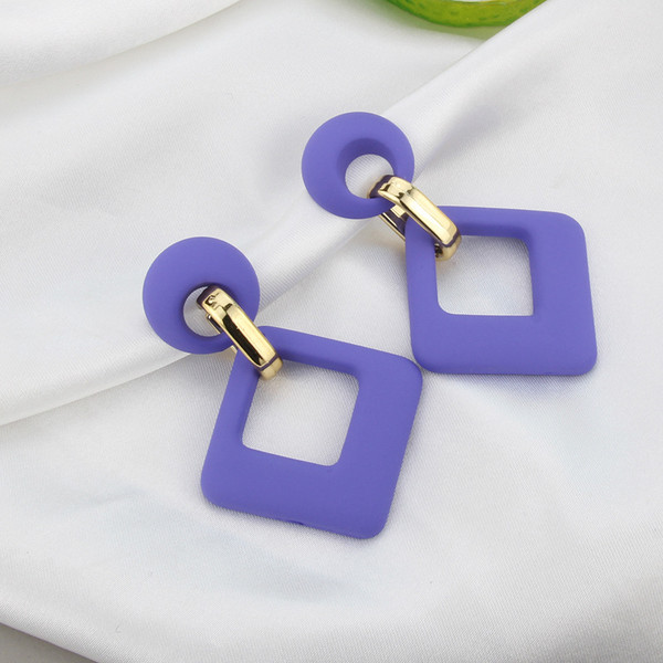 Geometric royal blue earrings with gold colour detail on stud