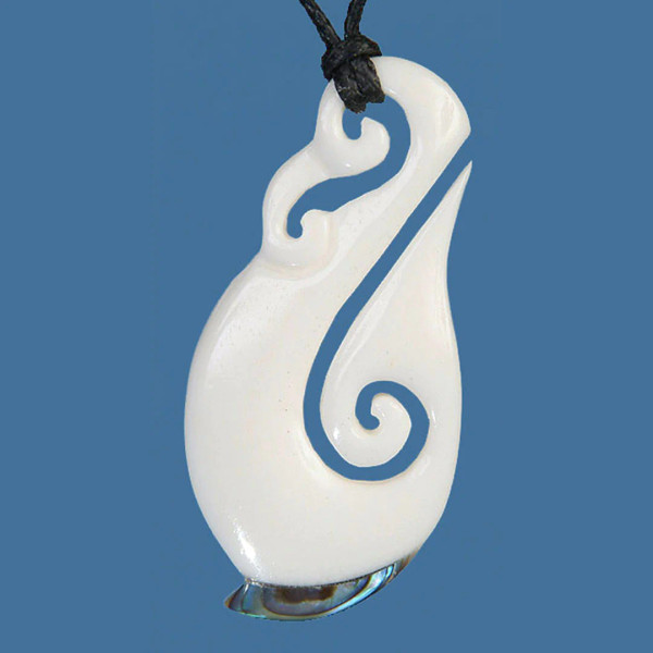 Hand carved bone stylised Hook pendant with piece of paua inset at base