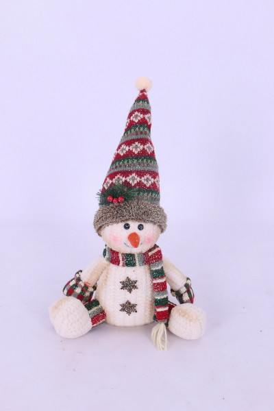 Sitting snowman with bobble hat and scarf