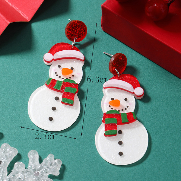Snowman with a bit of sparkle and a Christmas Hat hanging under red stud earrings on posts