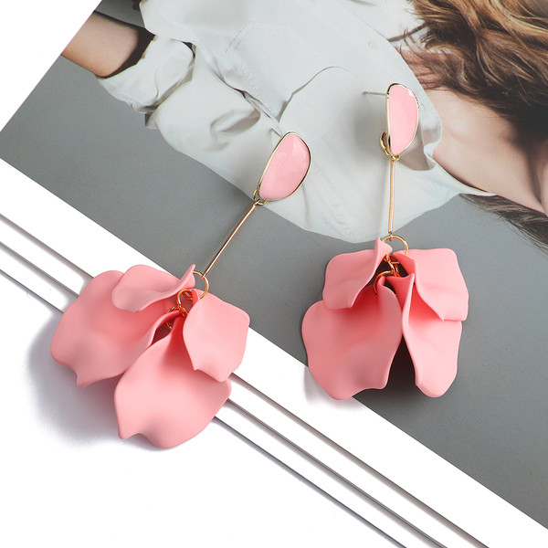 long earrings with candy pink flower petal hung from gold coloured rod beneath an acrylic stud on 925 posts