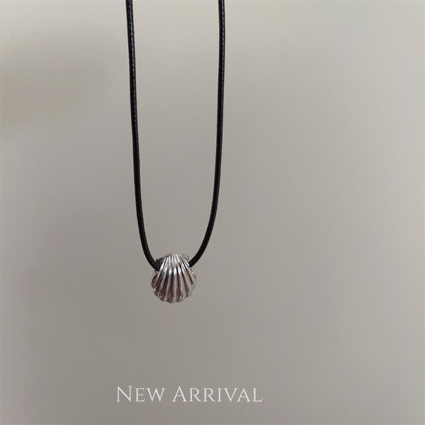 Black braided rope necklace with silver shell