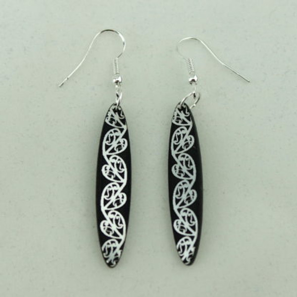 Kowhaiwhai oval small - Black with metallic silver detail