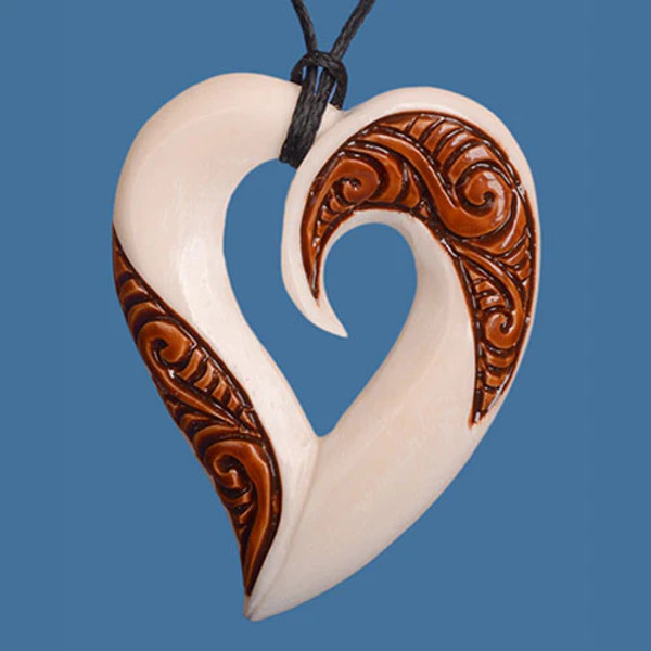 NZ Bone heart shaped pendant with stained accent on carving