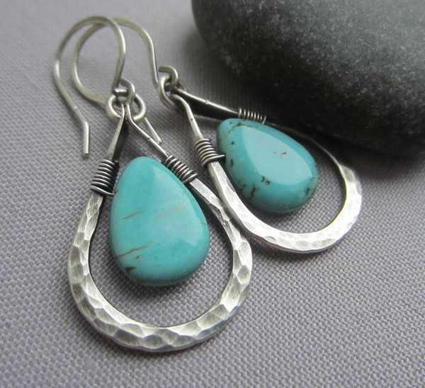 Silver teardrop with blue stone earrings on hooks