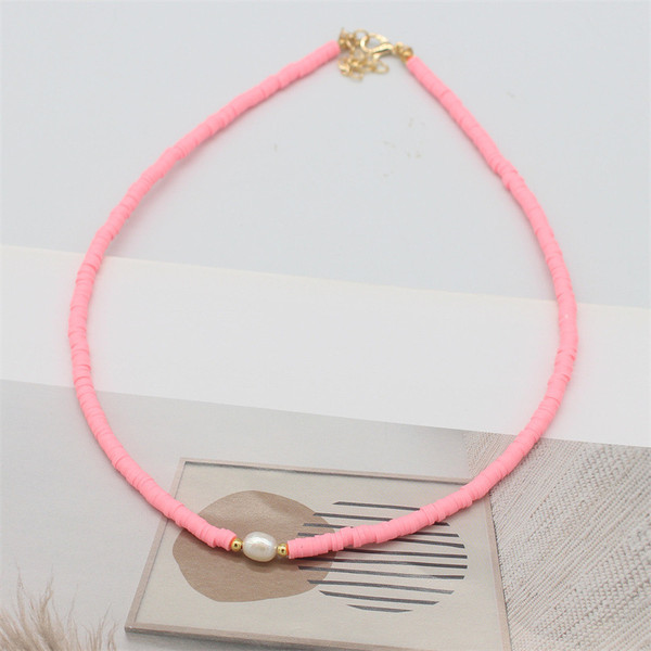Threaded flat bead necklace with faux pearl - pink