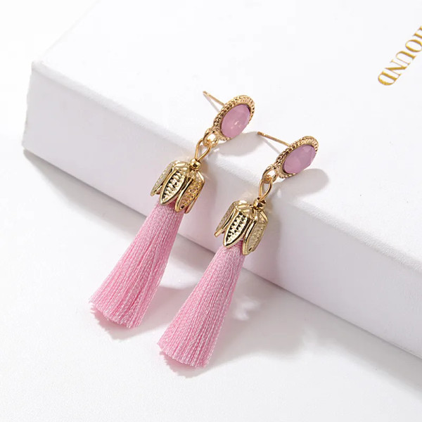 Pale Pink Tassel earring with gold coloured crown hanging from pink coloured stone stud