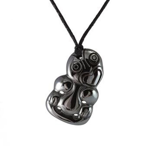 Hematite carved tiki pendant on cord