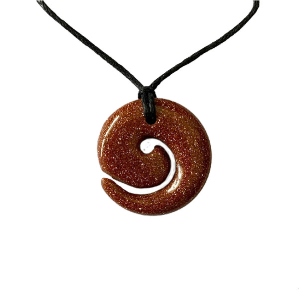 Goldstone Koru pendant on cord