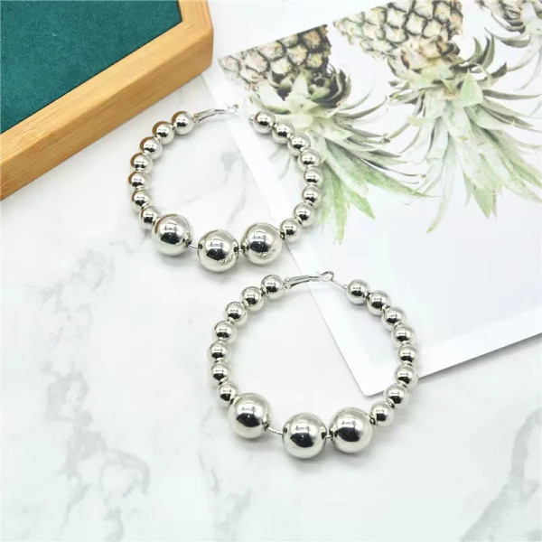 Large hoop earrings with multiple balls design