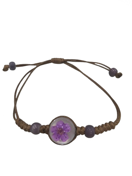 Bracelet with purple flower in glass bead on a brown cord