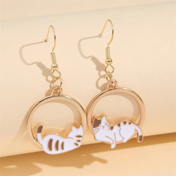 Cute cats laying in gold coloured circles earrings on hooks