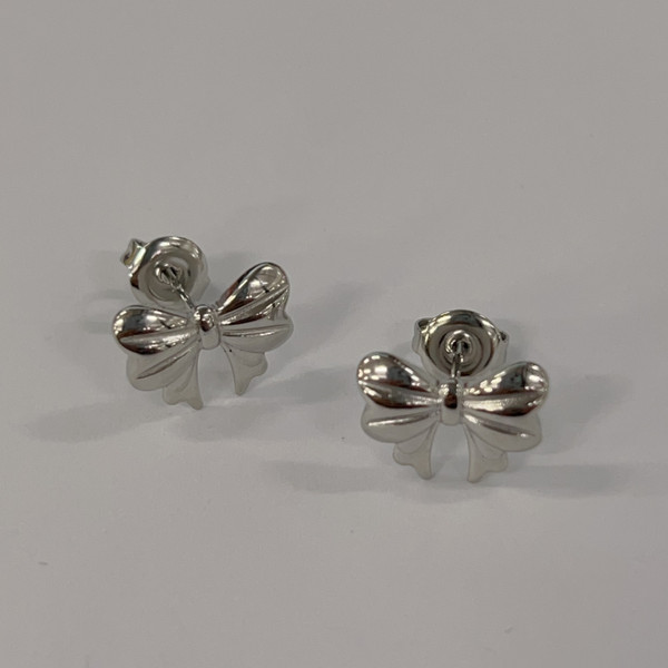 Cute bow earrings on studs -  silver coloured