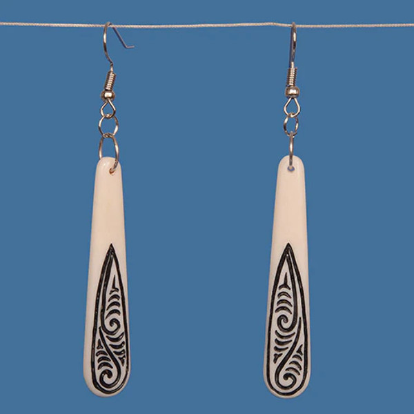 Bone teardrop earrings with black engraved koru design