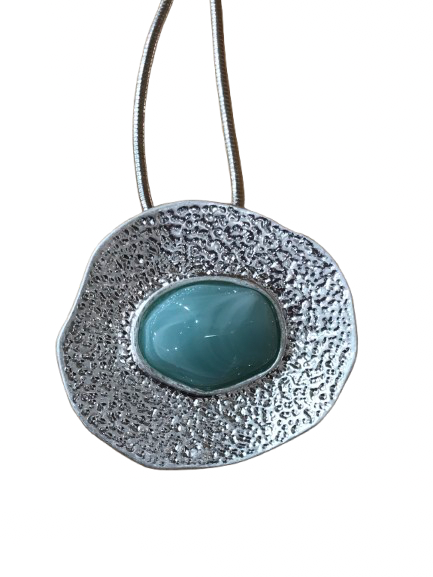 Silver coloured textured disc necklace with turquoise resin centre