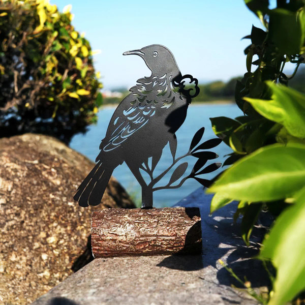 Metal NZ native Tui on log