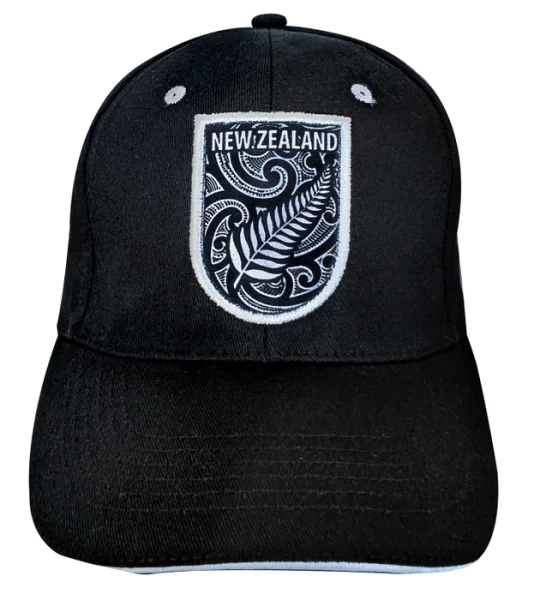 Black cotton New Zealand cap with silver fern and tattoo-style design