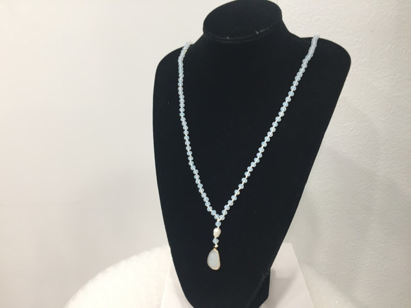 Crystal Drop with gold trim suspended below a pearl hung from a crystal bead necklace (comes in 4 colours)