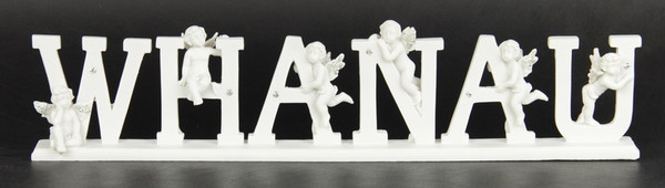 the word WHANAU with cherubs as a desktop or shelf sitter