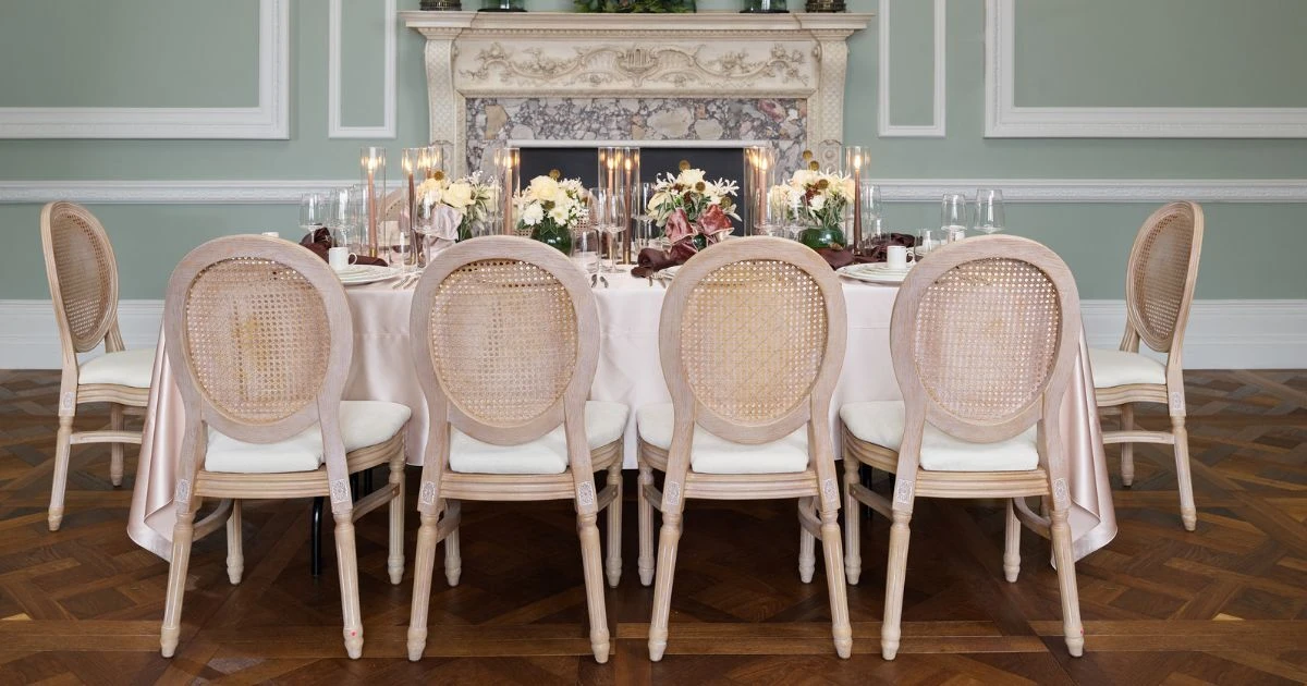 Elegant Autumn tablescape with Wedgwood Gio Gold plates, Sensa glassware, Victoria Gold cutlery and Louis Rattan chairs