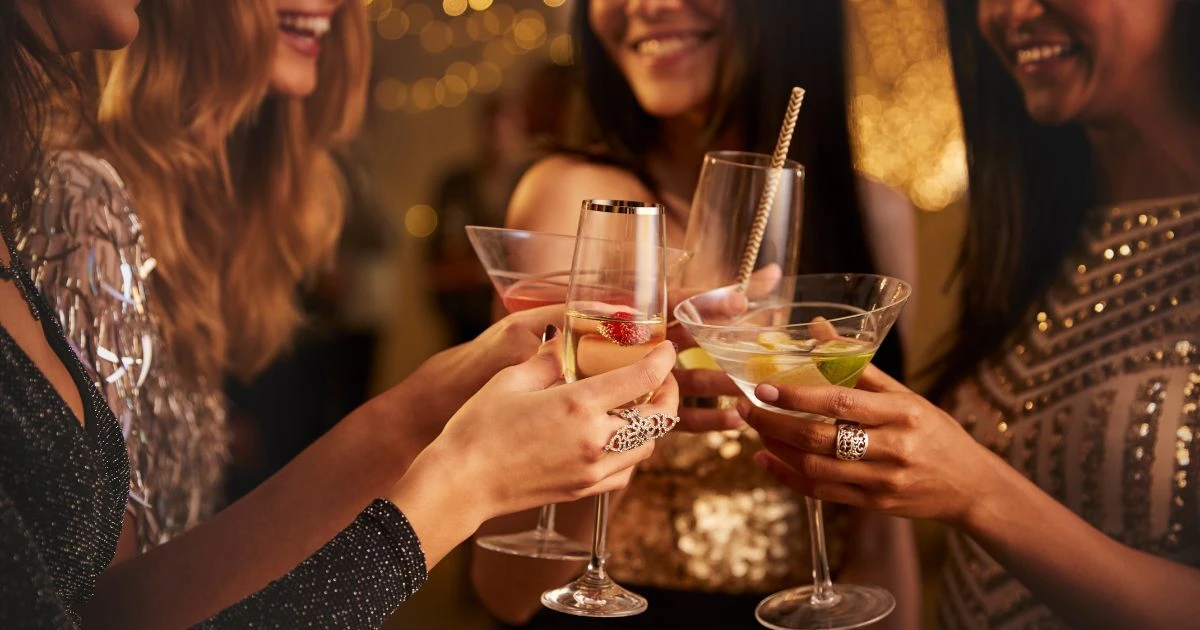 Guests enjoying a stylish drinks party with CaterHire glassware and bar equipment