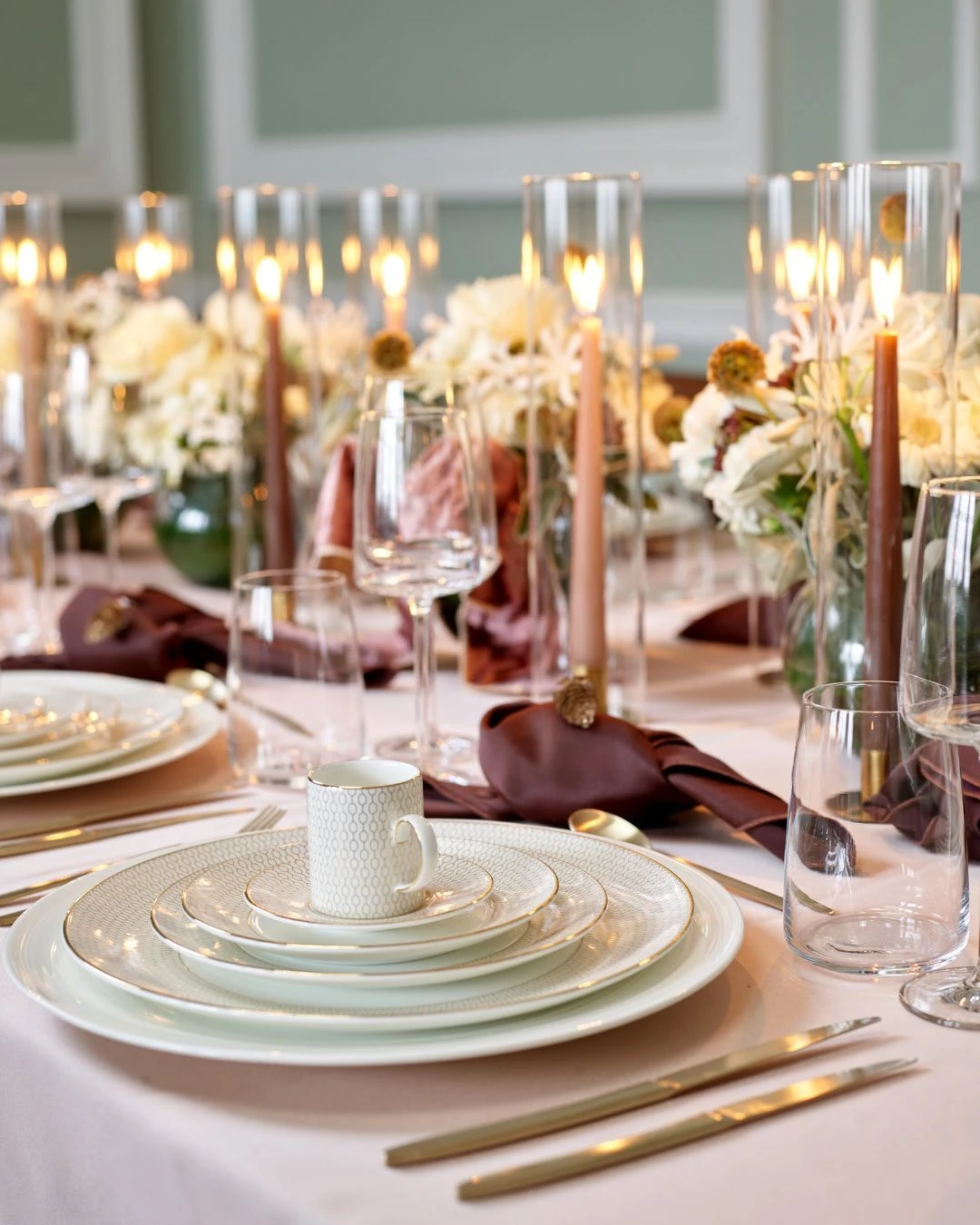Side view of a modern gold and white CaterHire table setting