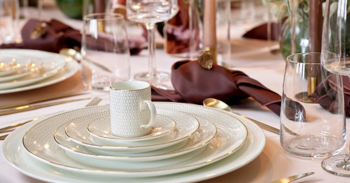 Richly layered Autumn tablescape featuring CaterHire tableware, cutlery and glassware
