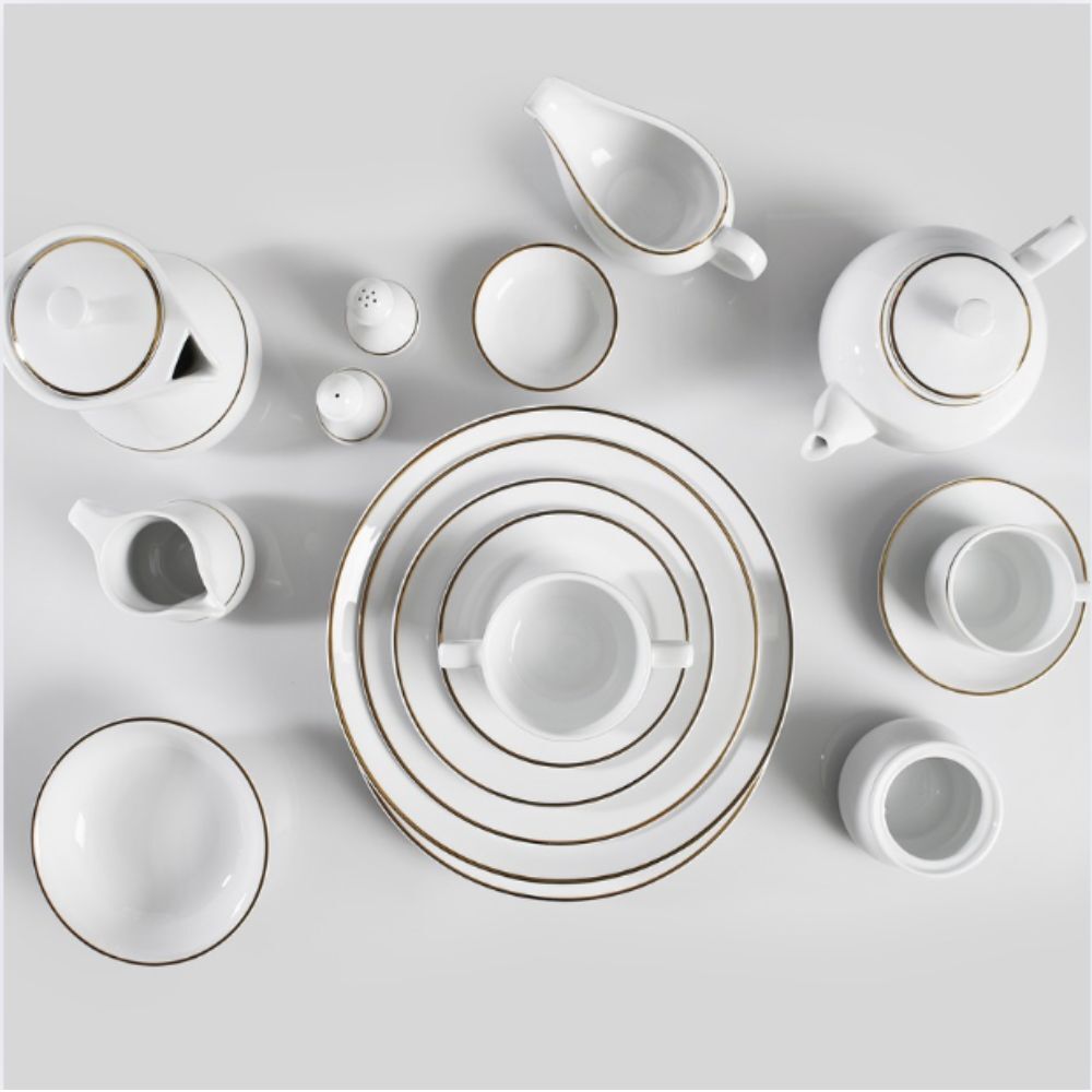 Gold rim crockery table setting for hire