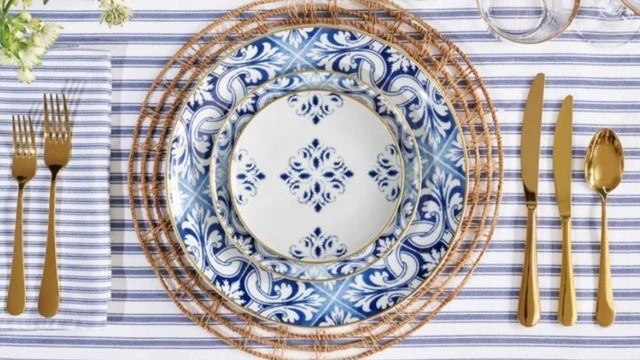 Formal dinner table with crockery, cutlery and glassware