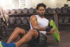 Actimove Sports Edition Thumb Stabilizer - with Man wearing while lifting weights