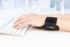 Actimove Everyday Supports Wrist Stabilizer Carpal - close up of hand wearing while typing