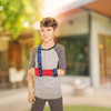 Actimove Sling Dispenser | Kids - with boy wearing the sling