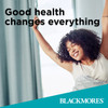 Blackmores Advertisement featuring a Woman with Arms outstretched