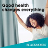 Blackmores Advertisement featuring a Woman with Arms outstretched