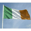 The Irish flag flying from an outdoor flagpole. The flag has three vertical stripes of green, white, and orange from left to right.