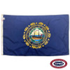 The dark blue New Hampshire flag has the state seal in the center, depicting a ship at sea in front of a sunrise. FMAA Certified Made in America seal.