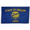 The dark blue Oregon state flag has a seal in the center and the text “State of Oregon 1859”. In the seal is an eagle, ships, and a wagon.