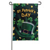 A green decorative flag that is covered in shamrocks. The middle says "St. Patrick's Day" with a green top hat below it. 