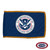 The indoor DHS flag has 3 sides of gold fringe around a blue field. In the center is a white seal depicting a bald eagle with a shield.